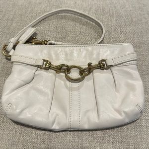 COACH off white leather wristlet. Like new condition.